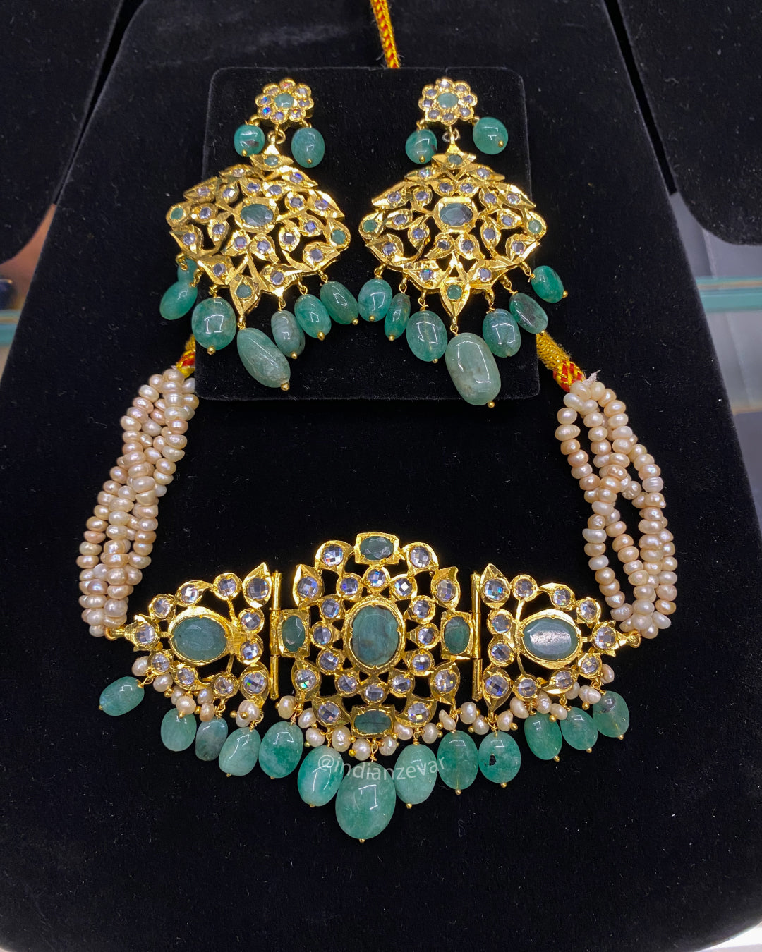Hyderabadi Jadau pearl choker necklace set for brides, featuring antique freshwater pearls, emeralds, and Polki stones, traditional gold choker design, Indian bridal jewelry, Rani haar, pearl jewellery, Hyderabad bridal jewelry online, buy Indian bridal jewelry in USA.