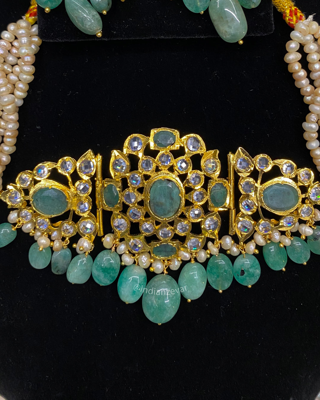 Pearl choker necklace in Hyderabadi Jadau style, handcrafted with emeralds, CZ Polki and pearls, traditional choker set for brides, Rani haar design, Indian wedding jewelry, south Indian jewelry for brides Canada UK, Hyderabad pearl jewelry store online.