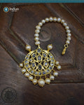 A close-up image of a Hyderabadi Jadau maang tika, adorned with CZ Polki stones, real freshwater pearls, and intricate gold-plated alloy work.
