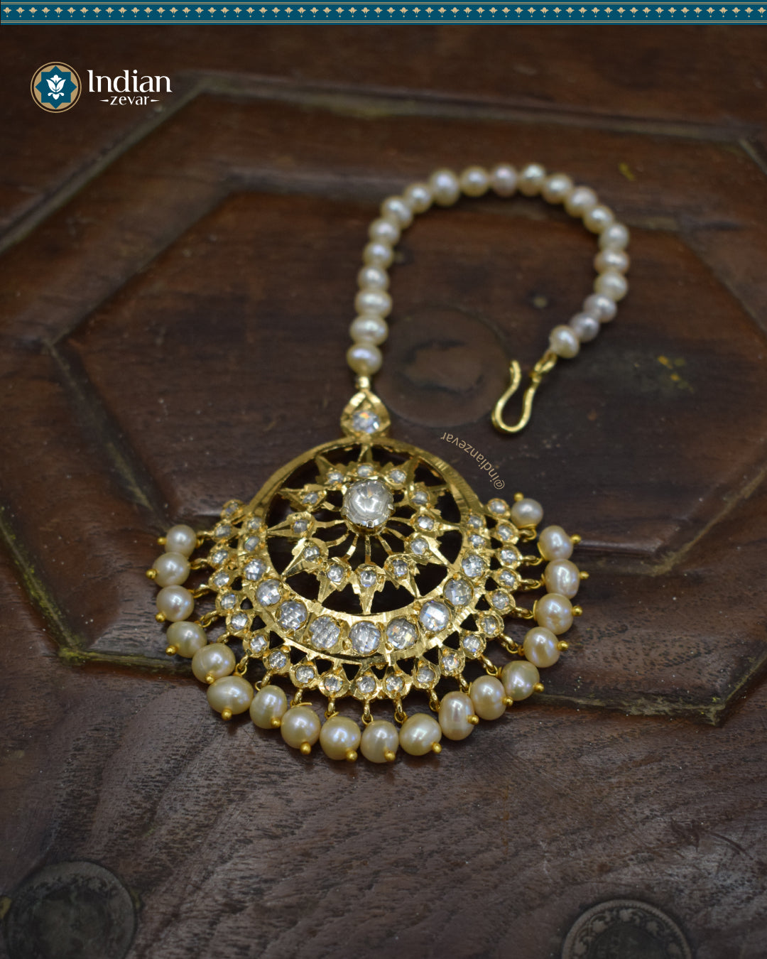 A close-up image of a Hyderabadi Jadau maang tika, adorned with Pachi Polki stones, real freshwater pearls, and intricate gold-plated alloy work.
