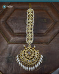 A close-up image of a Hyderabadi Jadau maang tika, adorned with CZ Polki stones, faux freshwater pearls, and intricate gold-plated alloy work
