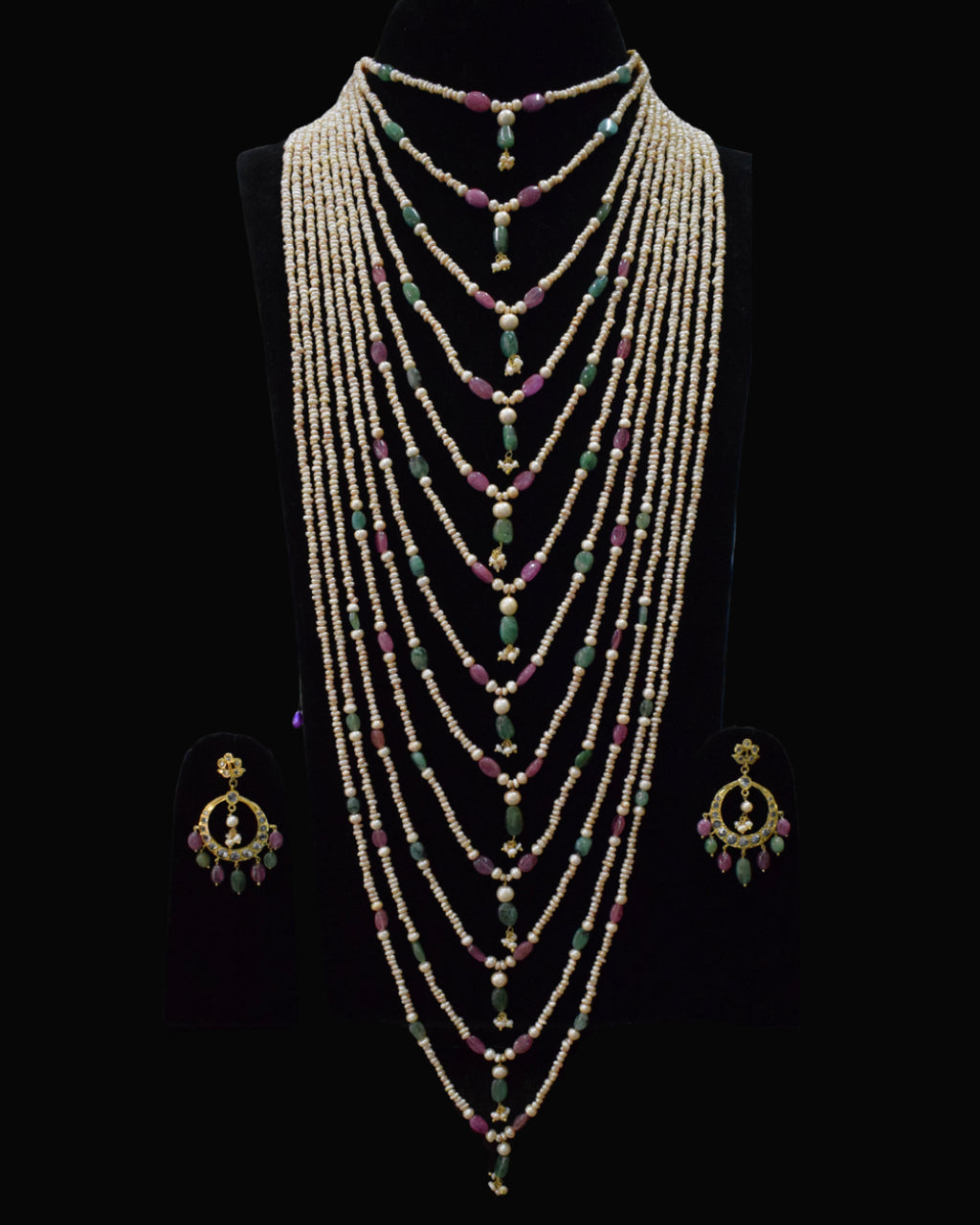 Indian Zevar The Grand Haar multi-string layered haar with freshwater pearls, ruby and emerald beads, CZ Polki and matching earrings.