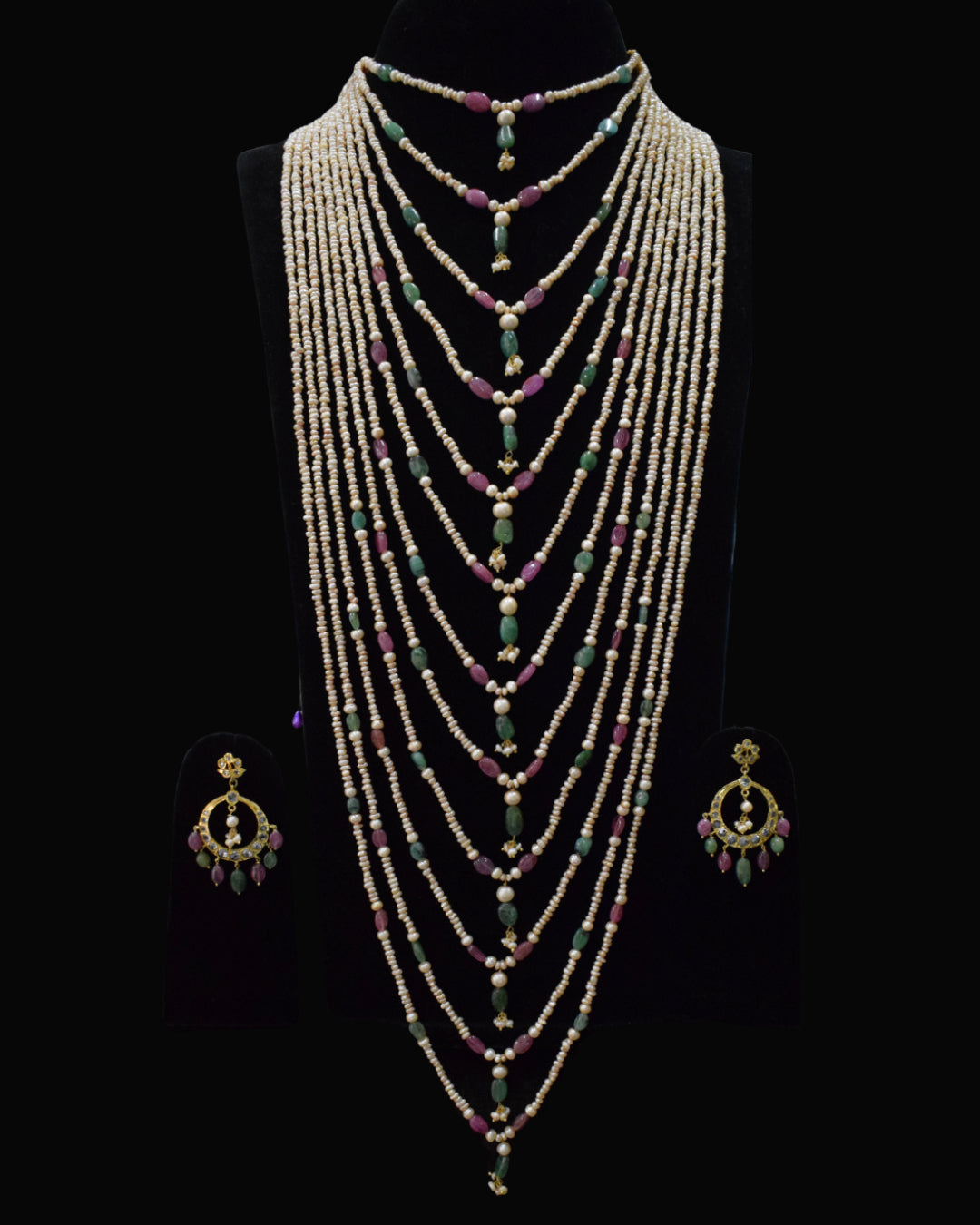 Indian Zevar The Grand Haar multi-string layered haar with freshwater pearls, ruby and emerald beads, CZ Polki and matching earrings.