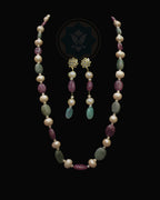 Indian Zevar Modern Muse necklace set with freshwater pearls, ruby and emerald beads, CZ Polki and matching earrings.
