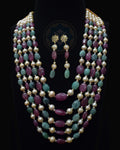 Indian Zevar five-string necklace set featuring big-size ruby beads, big-size emerald beads, freshwater pearls, CZ Polki and matching earrings.