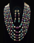 Indian Zevar five-string necklace set featuring big-size ruby beads, big-size emerald beads, freshwater pearls, CZ Polki and matching earrings.