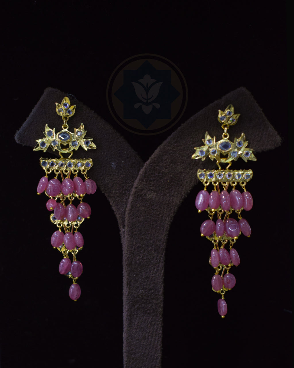 Pair of Indian Zevar Angoor Goshe chandelier earrings featuring real Bangkok Rubies, CZ Flat Cut Polki and premium gold polish on a copper base.