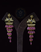 Pair of Indian Zevar Angoor Goshe chandelier earrings featuring real Bangkok Rubies, CZ Flat Cut Polki and premium gold polish on a copper base.