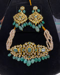 Hyderabadi Jadau pearl choker necklace set for brides, featuring antique freshwater pearls, emeralds, and Polki stones, traditional gold choker design, Indian bridal jewelry, Rani haar, pearl jewellery, Hyderabad bridal jewelry online, buy Indian bridal jewelry in USA.