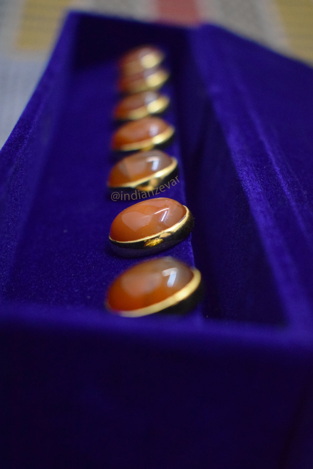 Traditional Indian men's button accessory with orange Hakik gemstones, set on alloy base in Jadau work.