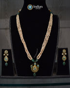 Elegant handcrafted Jugni necklace set with Hyderabadi gold plated Jadau design, CZ Polki and freshwater pearls.