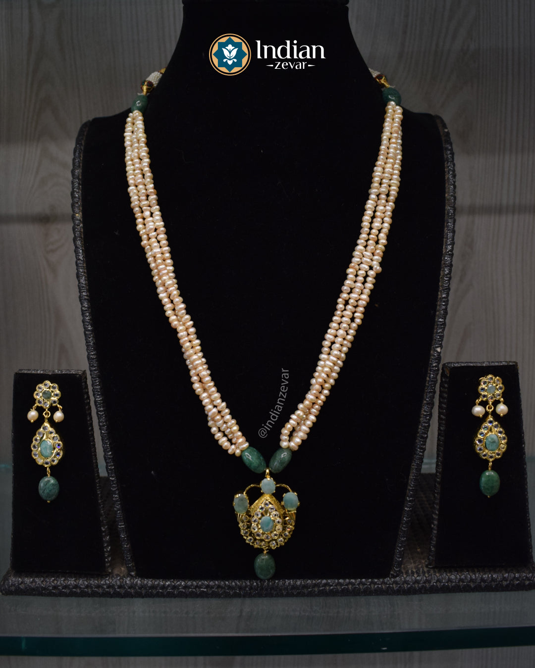 Elegant handcrafted Jugni necklace set with Hyderabadi gold plated Jadau design, CZ Polki and freshwater pearls.
