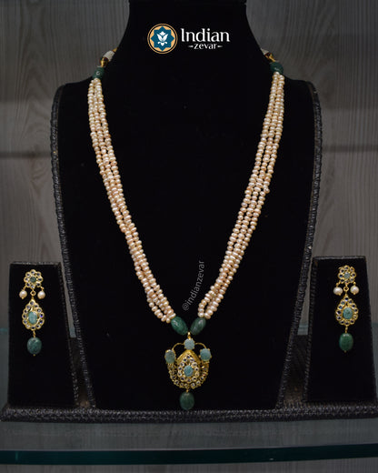 Elegant handcrafted Jugni necklace set with Hyderabadi gold plated Jadau design, CZ Polki and freshwater pearls.