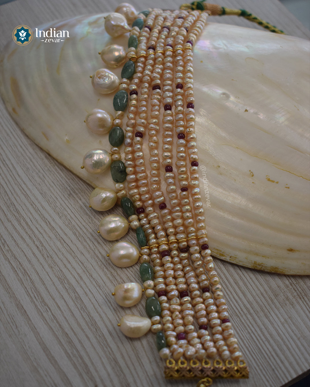 Handmade Seven-line choker with freshwater pearls, Ruby and Emerald beads, Baroque pearls, and gold-toned metal connectors finished with a green braided cord, handcrafted by Indian Zevar.