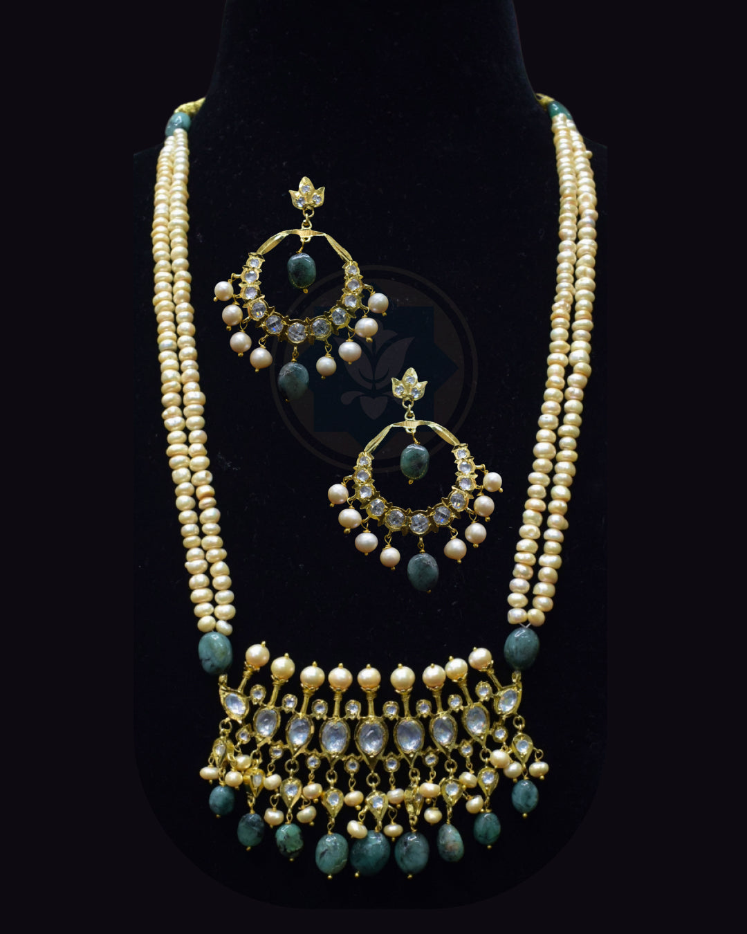 Indian Zevar Tirmani Rani Haar necklace set with two strands of uneven freshwater pearls, Sakota Brazilian Emeralds, Moissanite Polki and matching Chandbali earrings.