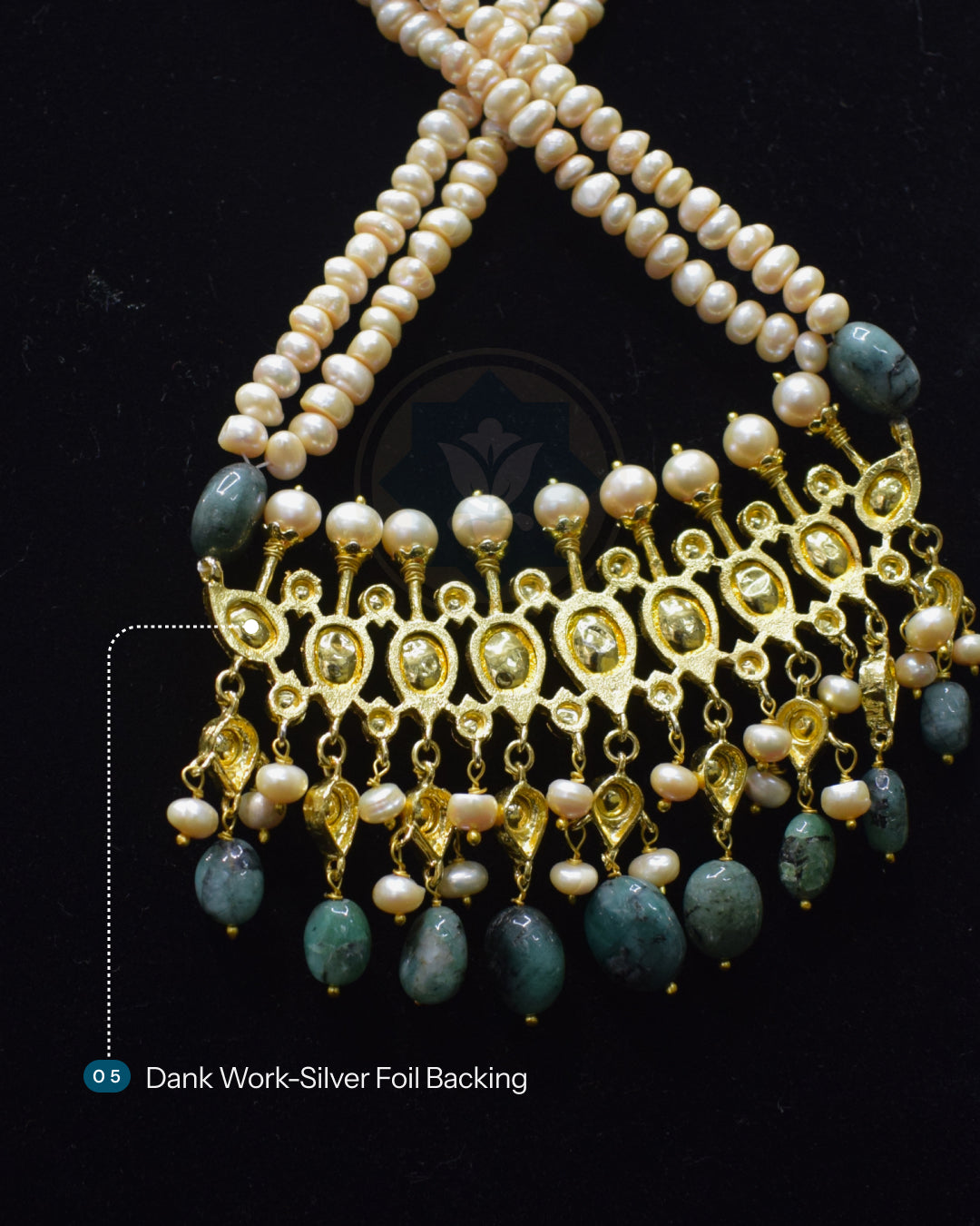 Baside of Indian Zevar Tirmani Rani Haar necklace set with two strands of uneven freshwater pearls, Sakota Brazilian Emeralds, Moissanite Polki and matching Chandbali earrings.