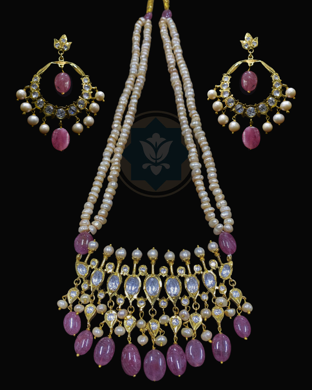 Indian Zevar Tirmani Rani Haar necklace set with two strands of uneven freshwater pearls, real Bangkok Ruby beads, synthetic Moissanite Polki and matching Chandbali earrings.