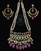 Indian Zevar Tirmani Rani Haar necklace set with two strands of uneven freshwater pearls, real Bangkok Ruby beads, synthetic Moissanite Polki and matching Chandbali earrings.