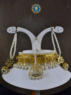 Complete your traditional look with our handmade Classic Hyderabadi Choker Set. Featuring faux pearls and intricate design, this set includes a Maang Tikka and matching Jhumka earrings. Perfect for adding a touch of elegance to any outfit.