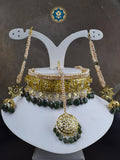 Get the complete traditional look with our Classic Hyderabadi Choker Set, including a Maang Tikka and Jhumka pair. Handcrafted with real freshwater old pearls and dark emeralds, this set is a true work of art